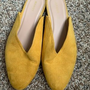Yellow suede mules/flats